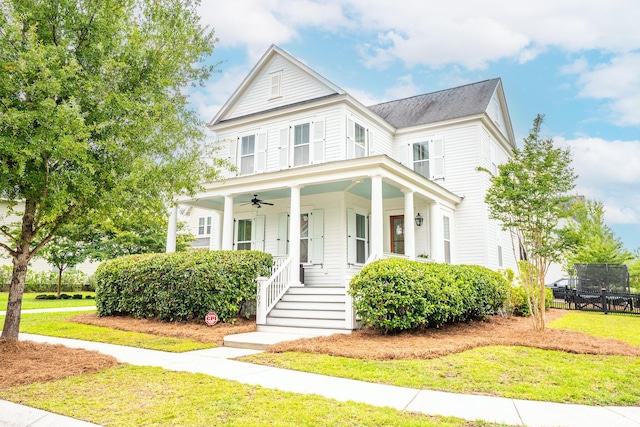 3707 Gambrill Ln, Mount Pleasant, SC 29466 - view of front of house with a ceiling fan, covered porch, and a front lawn