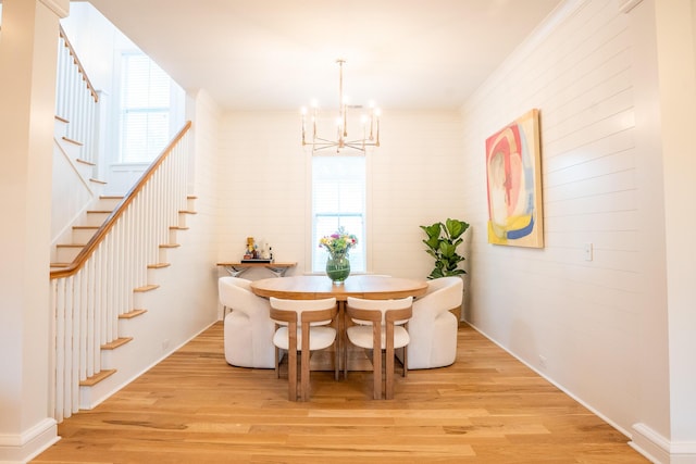 3707 Gambrill Ln, Mount Pleasant, SC 29466 - dining space featuring stairway, a chandelier, light wood-type flooring, and healthy amount of natural light