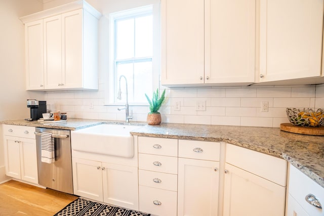 3707 Gambrill Ln, Mount Pleasant, SC 29466 - kitchen with stainless steel dishwasher, a sink, decorative backsplash, and white cabinets