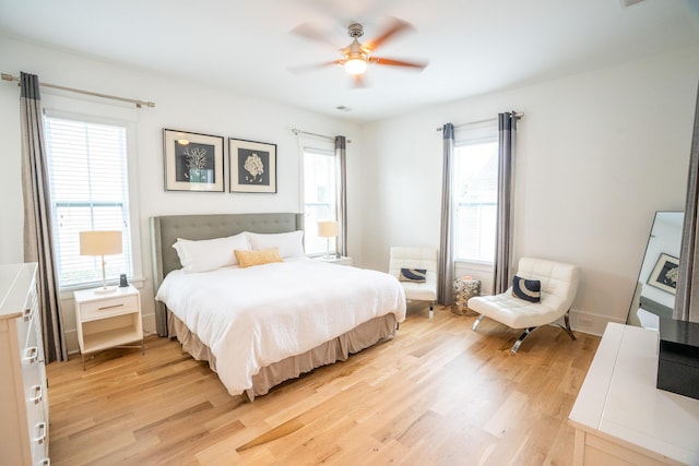 3707 Gambrill Ln, Mount Pleasant, SC 29466 - bedroom featuring light wood finished floors, multiple windows, and ceiling fan
