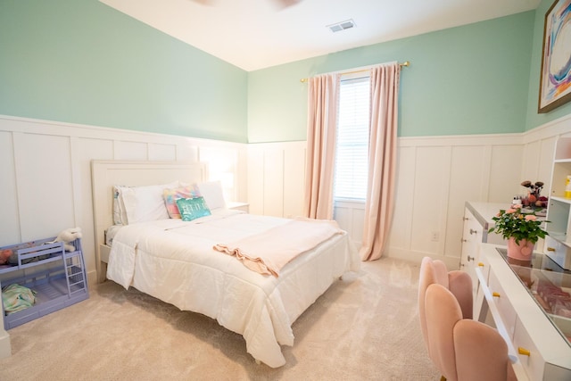 3707 Gambrill Ln, Mount Pleasant, SC 29466 - bedroom with a decorative wall, wainscoting, and light colored carpet