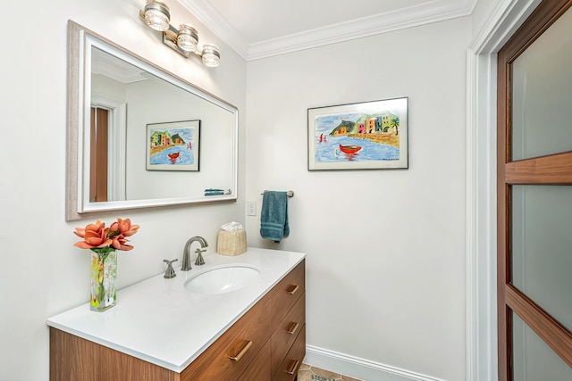 bathroom featuring crown molding, vanity, and baseboards