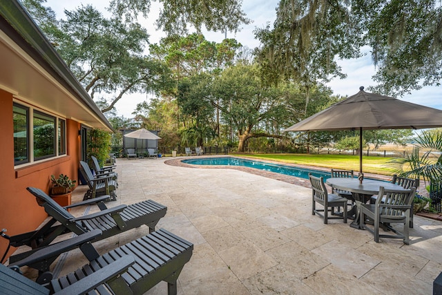 pool featuring outdoor dining area and a patio