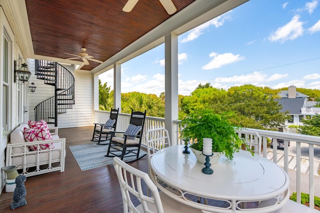 deck with stairs and ceiling fan