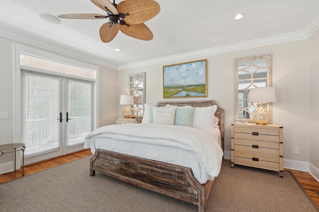 bedroom featuring ornamental molding, a ceiling fan, wood finished floors, and access to exterior