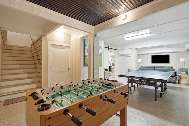 game room featuring wooden walls