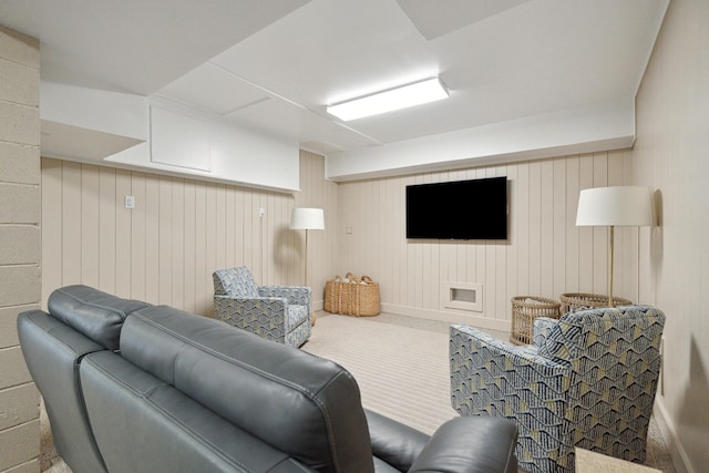 living room with wood walls