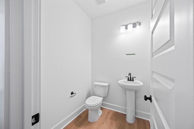7210 Raw Dew Dr, Awendaw, SC 29429 - half bathroom featuring toilet and wood finished floors