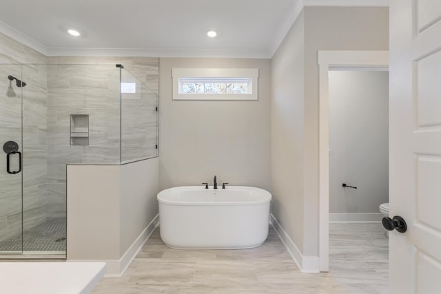 bathroom with toilet, separate shower and tub, and ornamental molding