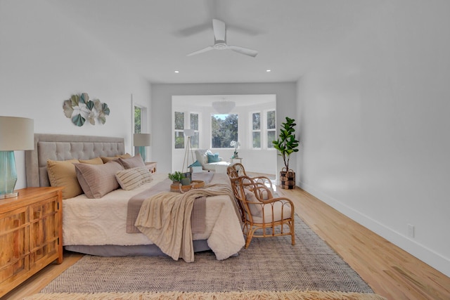 bedroom with hardwood / wood-style floors and ceiling fan