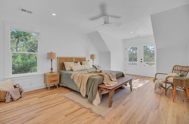 bedroom featuring access to outside, ceiling fan, light hardwood / wood-style floors, and french doors