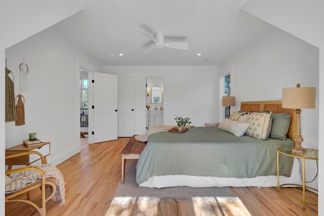 bedroom with light hardwood / wood-style flooring, ensuite bath, and ceiling fan