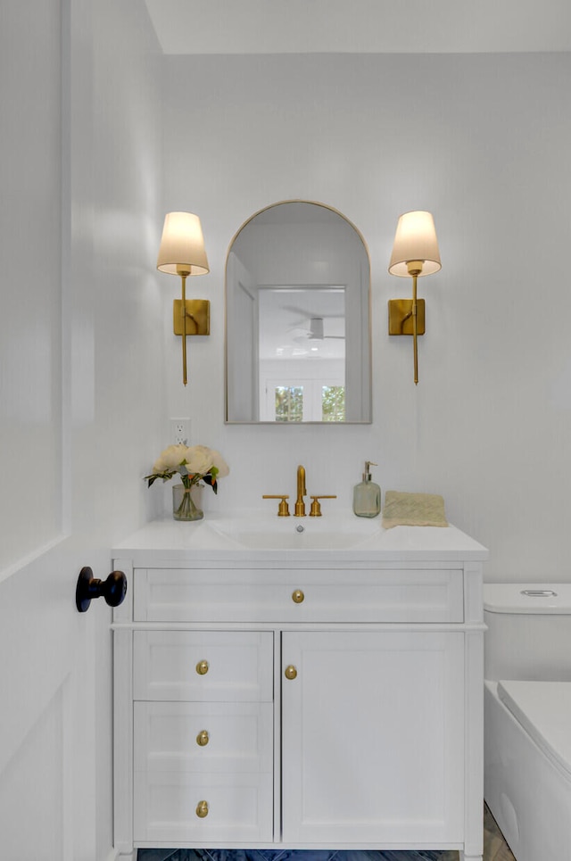 bathroom with vanity and toilet