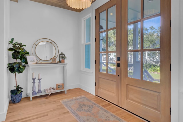 doorway featuring plenty of natural light, french doors, and hardwood / wood-style flooring