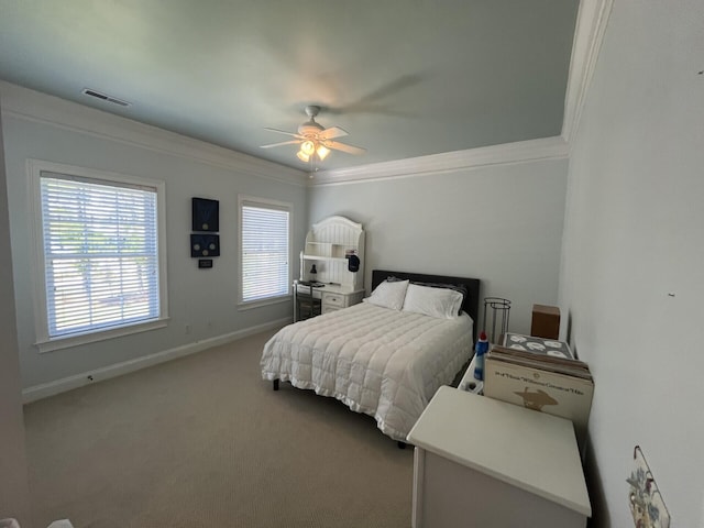 bedroom featuring ceiling fan, carpet, baseboards, ornamental molding, and visible vents