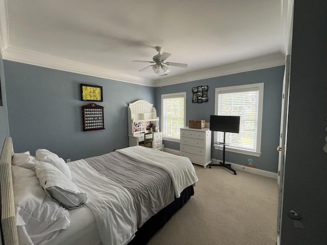 bedroom featuring ceiling fan, crown molding, light colored carpet, and baseboards