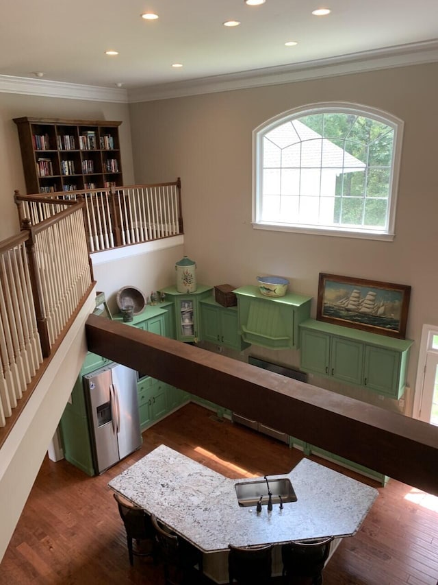 playroom featuring recessed lighting, wood finished floors, and ornamental molding