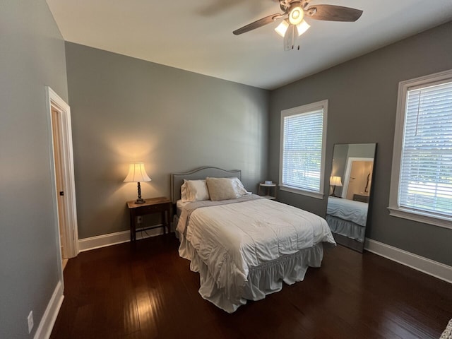 bedroom with wood finished floors, ceiling fan, and baseboards