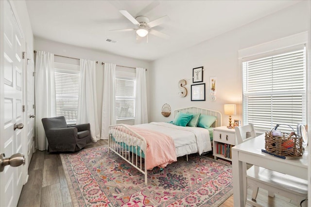 bedroom with ceiling fan and hardwood / wood-style floors