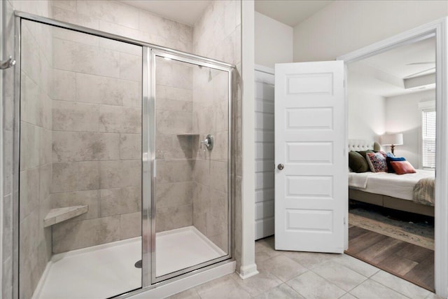 bathroom featuring walk in shower and tile patterned flooring