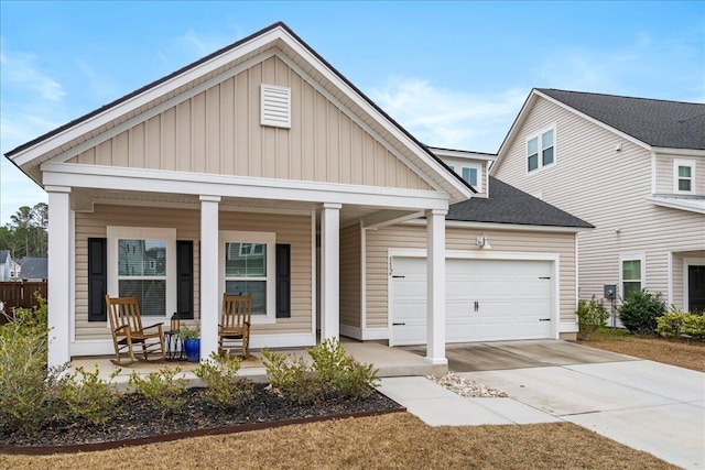 view of front of home with covered porch and a garage