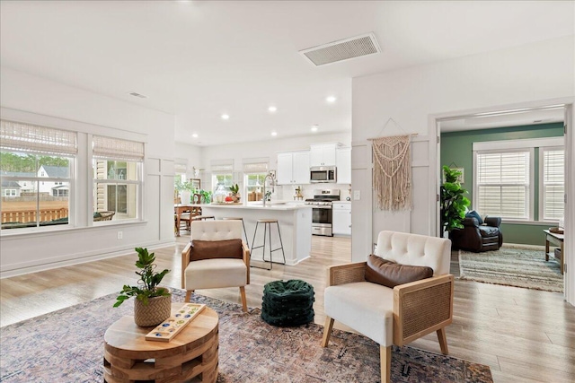 living room featuring light hardwood / wood-style floors