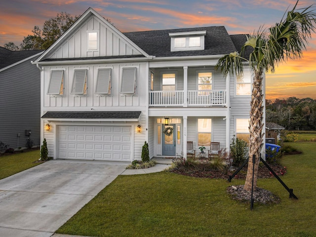 view of front of home featuring a garage and a yard