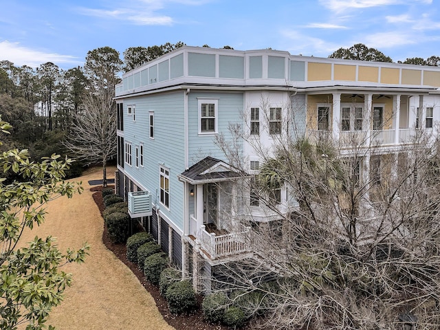 back of property featuring ceiling fan