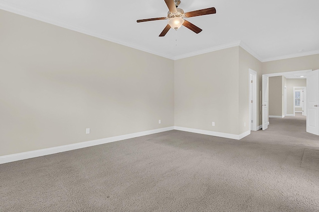 spare room featuring a ceiling fan, baseboards, carpet floors, and ornamental molding