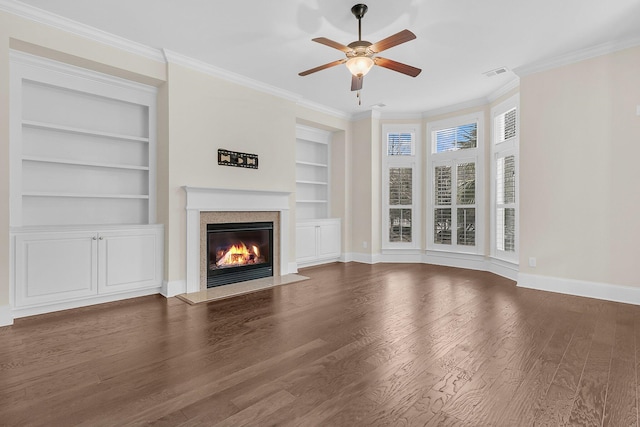 unfurnished living room featuring visible vents, crown molding, a fireplace with flush hearth, and wood finished floors