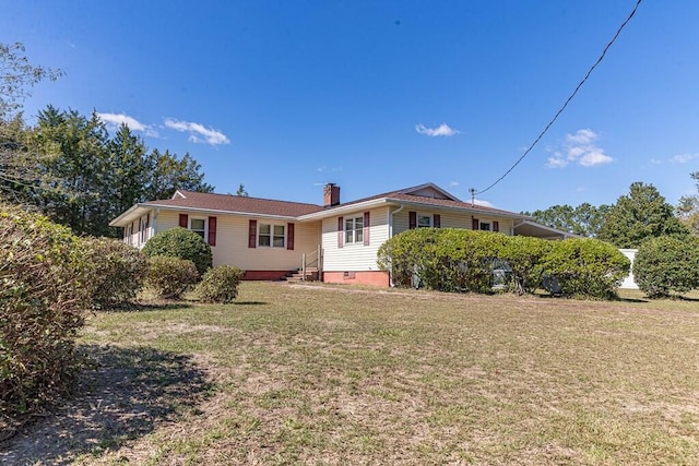 back of house with a yard