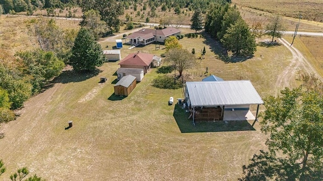 birds eye view of property featuring a rural view