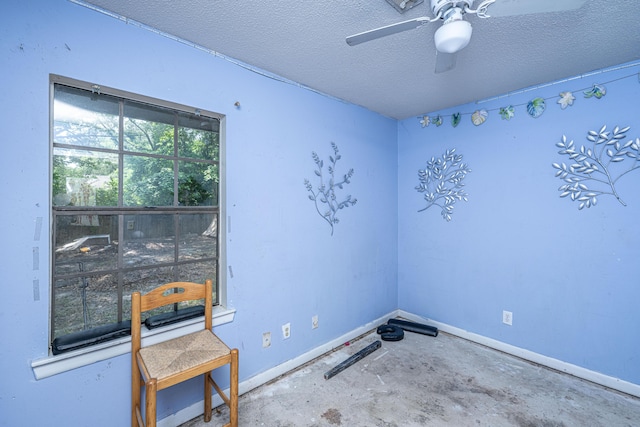 1004 Miles Jamison Rd, Summerville, SC 29485 - spare room with baseboards, a textured ceiling, a ceiling fan, and concrete floors
