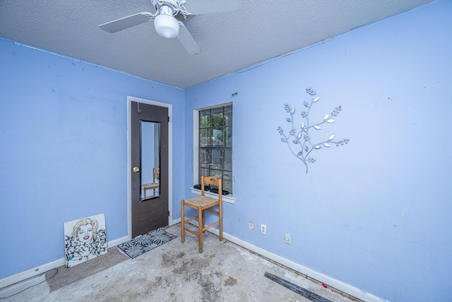 1004 Miles Jamison Rd, Summerville, SC 29485 - unfurnished room featuring a textured ceiling, baseboards, unfinished concrete flooring, and ceiling fan