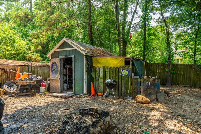 1004 Miles Jamison Rd, Summerville, SC 29485 - view of shed with a fire pit and a fenced backyard