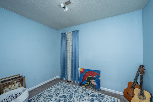 1004 Miles Jamison Rd, Summerville, SC 29485 - carpeted bedroom featuring baseboards and a textured ceiling