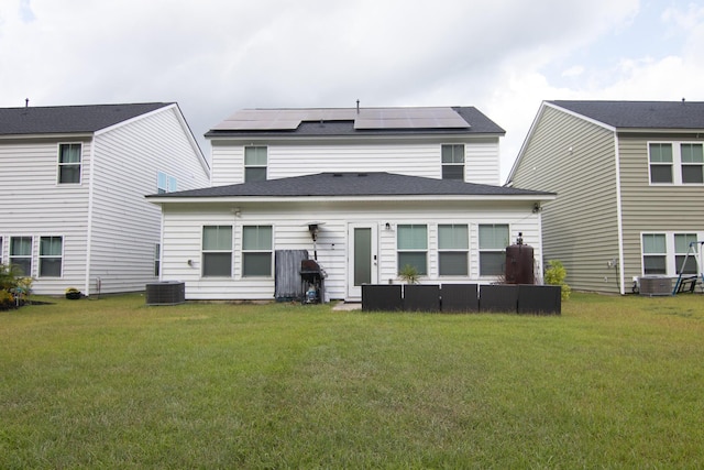 217 Pink Azalea St, Summerville, SC 29485 - rear view of house featuring a shingled roof, a lawn, and roof mounted solar panels