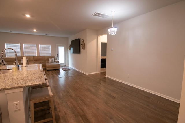 217 Pink Azalea St, Summerville, SC 29485 - kitchen featuring baseboards, open floor plan, dark wood-style floors, visible vents, and a sink