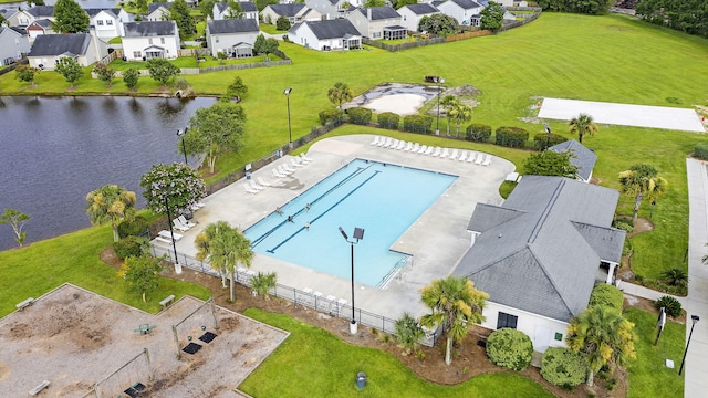 drone / aerial view with a water view and a residential view