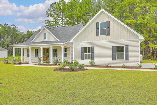 view of front of home with a porch and a front yard