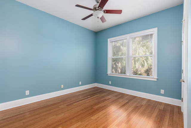 unfurnished room with hardwood / wood-style floors and ceiling fan