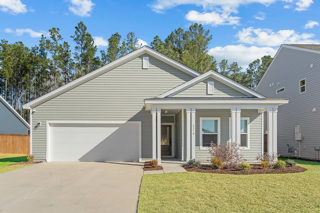 view of front of property with a front lawn, a porch, fence, concrete driveway, and a garage