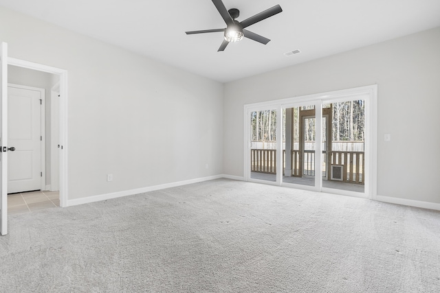 unfurnished room featuring visible vents, baseboards, light colored carpet, and ceiling fan