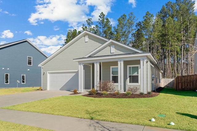 view of front of house with a front yard, a porch, driveway, and fence