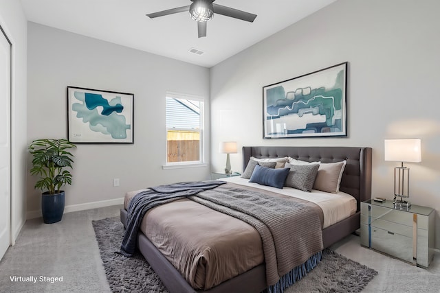 bedroom with visible vents, baseboards, carpet floors, and ceiling fan