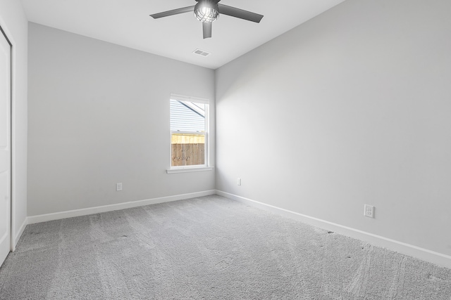 unfurnished room featuring visible vents, baseboards, ceiling fan, and carpet flooring