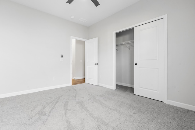 unfurnished bedroom featuring visible vents, baseboards, a closet, and carpet flooring