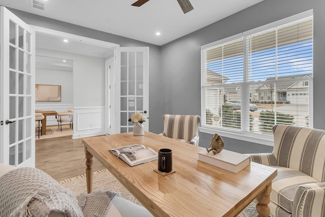 dining room featuring light hardwood / wood-style floors and ceiling fan