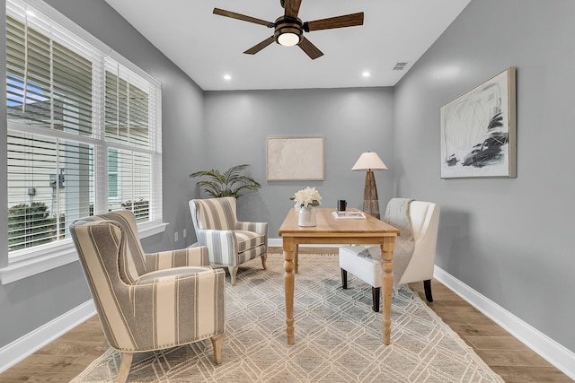 office area with ceiling fan and wood-type flooring