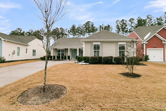 view of front of house featuring a garage and a front yard